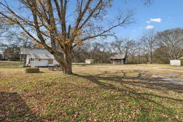 a house with trees in the background