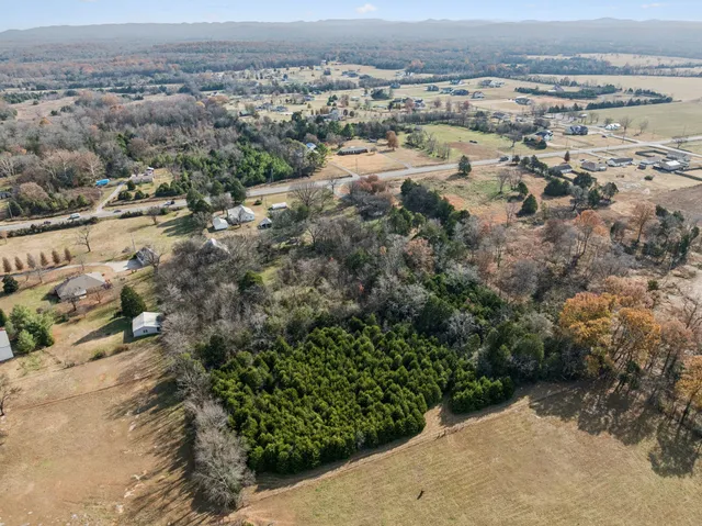 a aerial view of a house with a yard