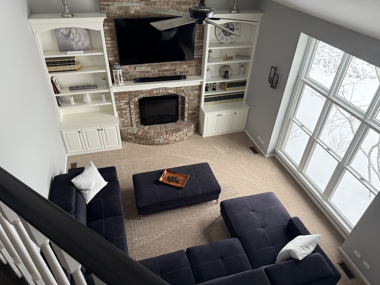 1N539 Turnberry Lane Winfield, IL 60190 - Photo 11 of 41 a living room with furniture a flat screen tv and a fireplace