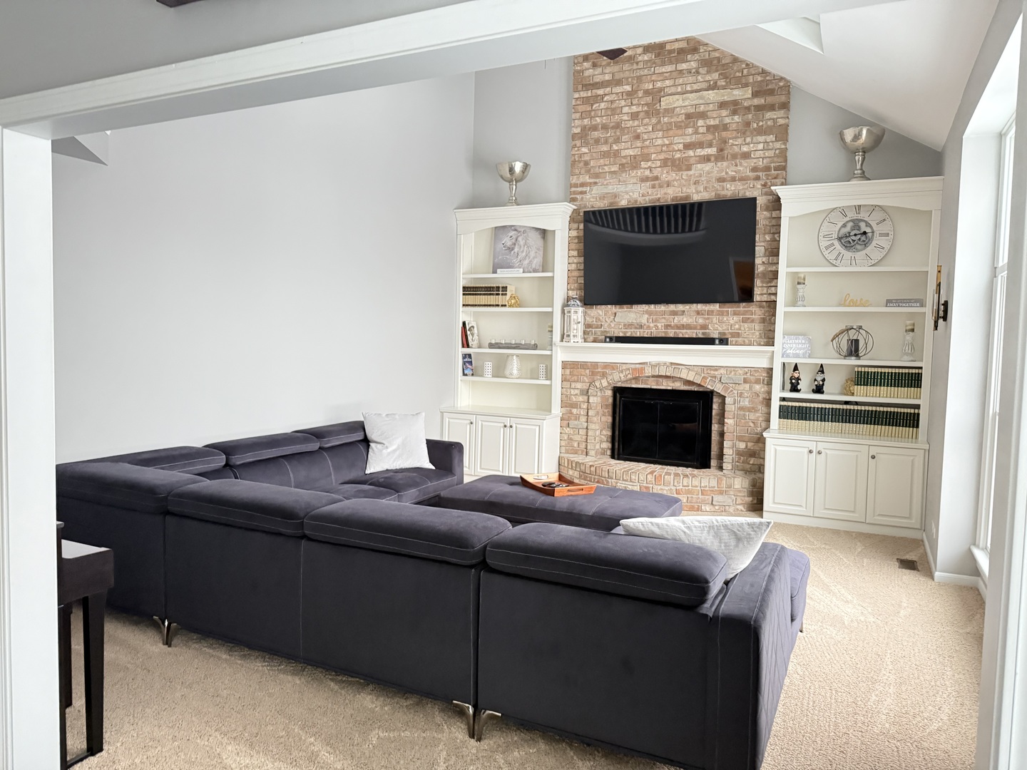 1N539 Turnberry Lane Winfield, IL 60190 - Photo 12 of 41 a living room with furniture flat screen tv and a fireplace