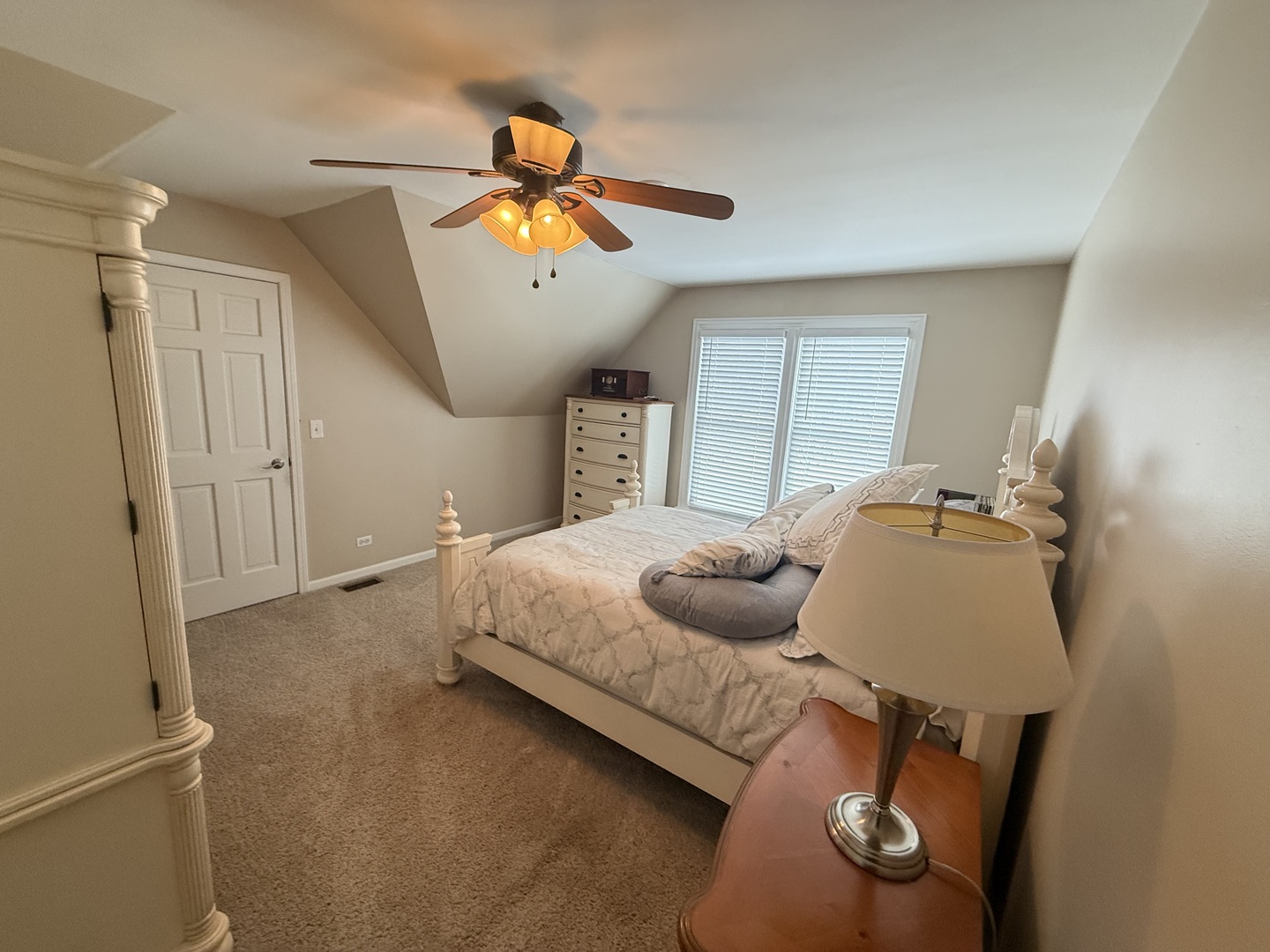 1N539 Turnberry Lane Winfield, IL 60190 - Photo 21 of 41 a bedroom with a bed and a chandelier