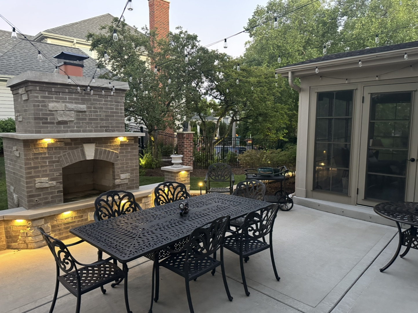 1N539 Turnberry Lane Winfield, IL 60190 - Photo 31 of 41 a view of a patio with table and chairs and potted plants