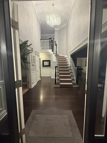 a kitchen with stainless steel appliances kitchen island granite countertop a refrigerator and cabinets