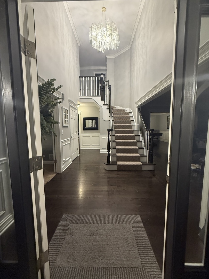 1N539 Turnberry Lane Winfield, IL 60190 - Photo 4 of 41 a view of entryway and hall with wooden floor
