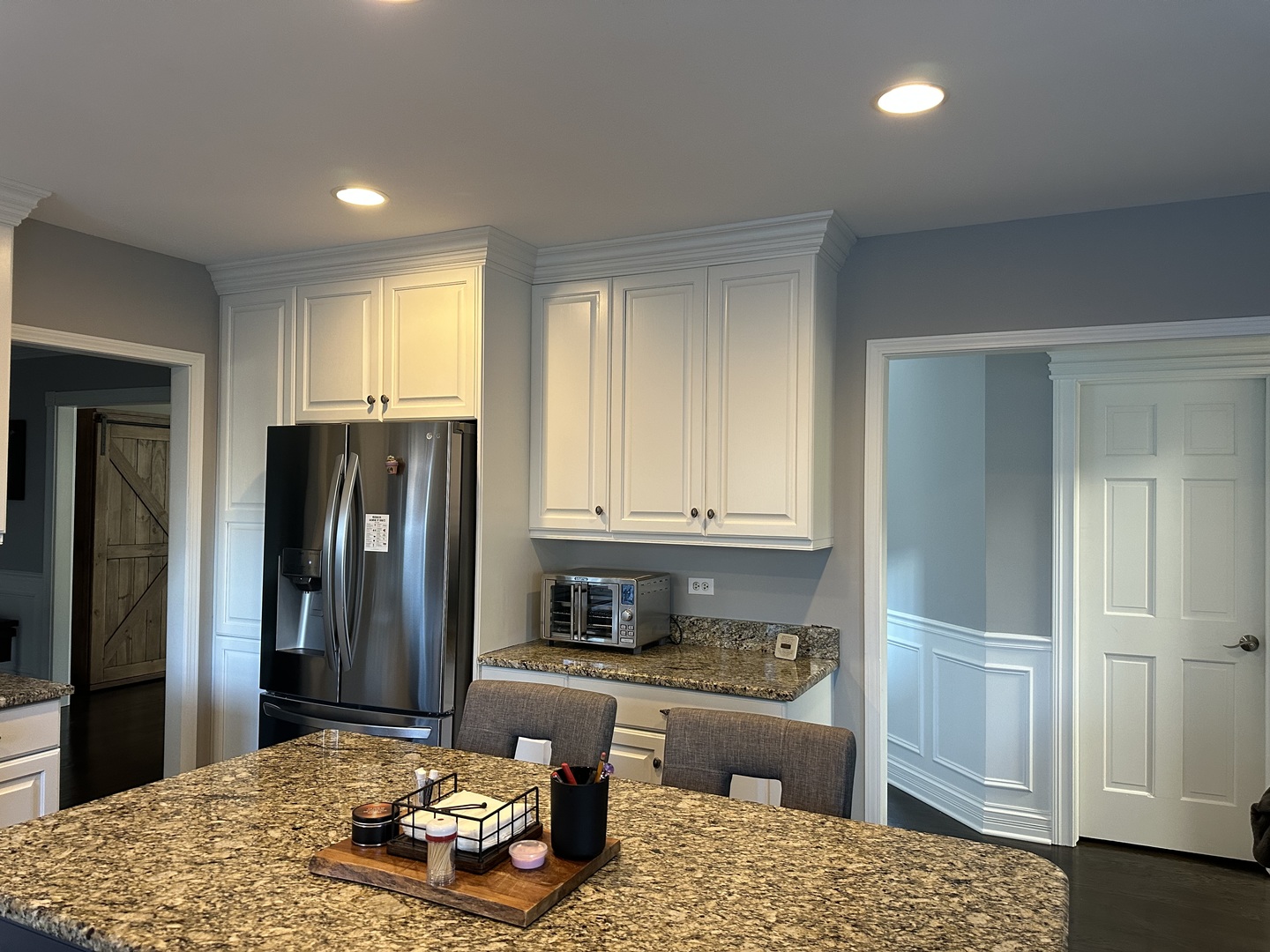 1N539 Turnberry Lane Winfield, IL 60190 - Photo 9 of 41 a kitchen with stainless steel appliances kitchen island granite countertop a refrigerator and cabinets