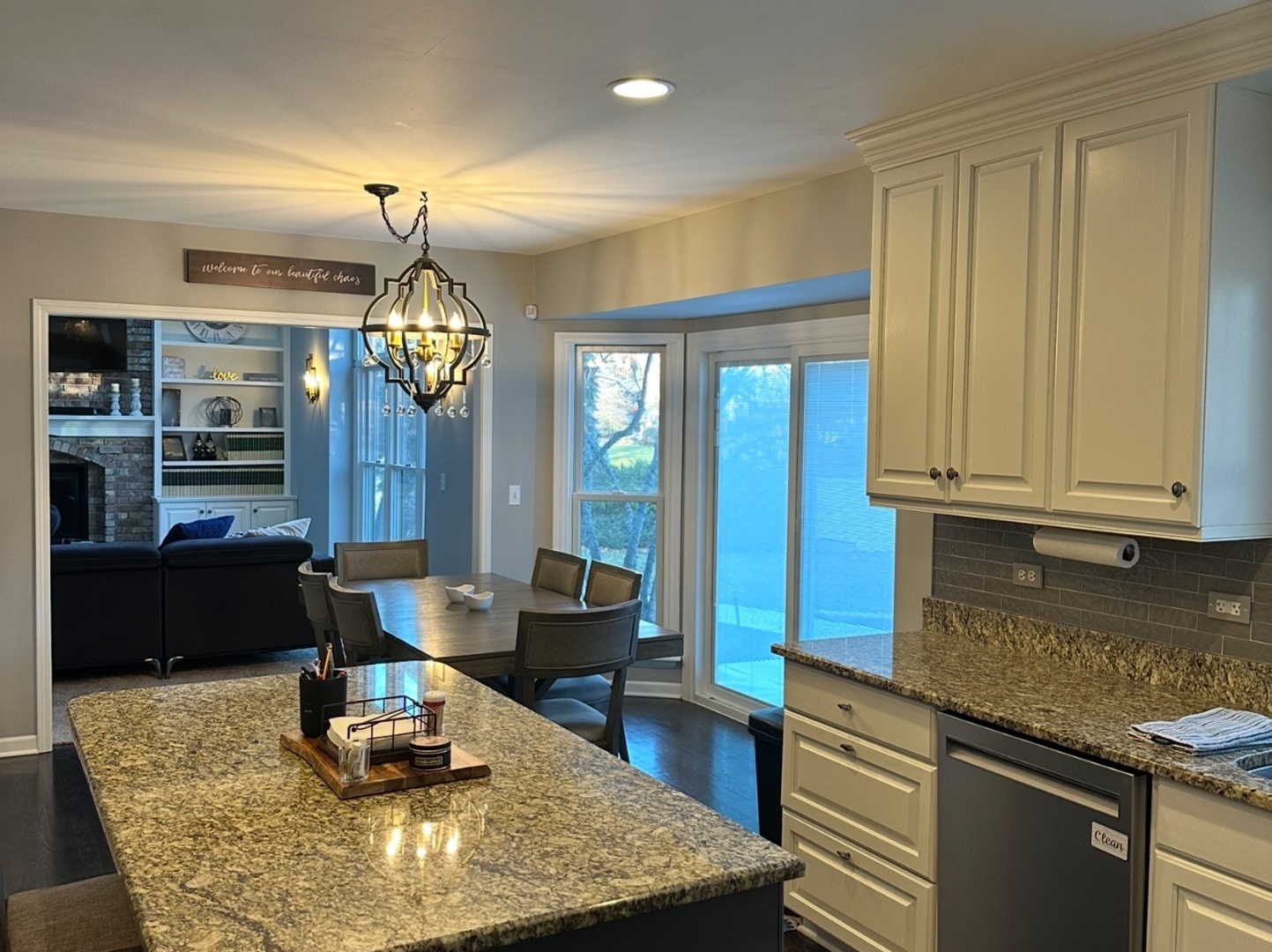 1N539 Turnberry Lane Winfield, IL 60190 - Photo 10 of 41 a kitchen with kitchen island granite countertop wooden cabinets and a counter top space