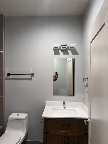 a bathroom with a toilet and bathtub