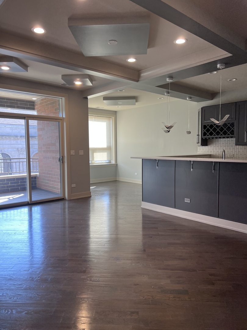1208 East 64th Street, Unit 3D Chicago, IL 60637 - Photo 6 of 20 a view of a hallway with wooden floor