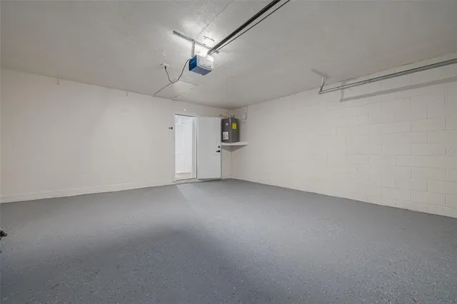 an empty room with a empty space and a ceiling fan