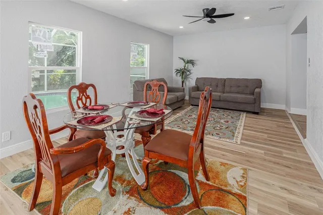 a view of a dining room with furniture window and outside view