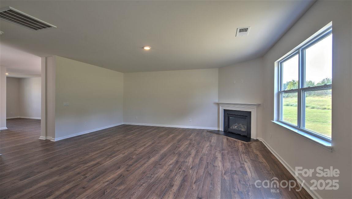 288 Salers Road Fletcher, NC 28732 - Photo 16 of 31 a view of an empty room with wooden floor and a window