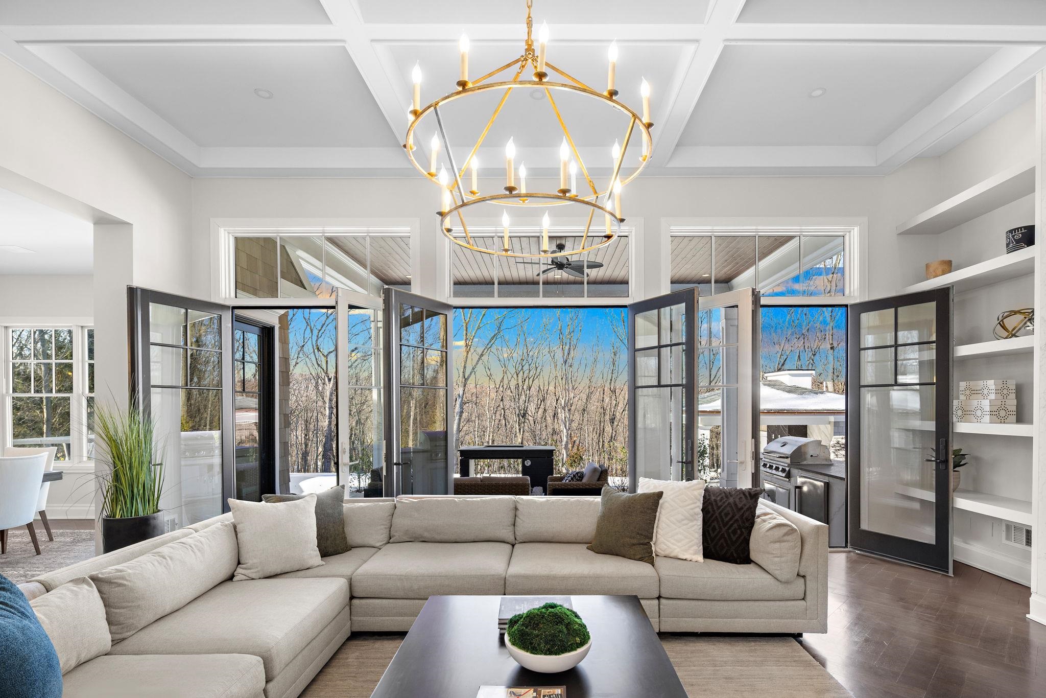 396 Knollwood Road Ridgewood, NJ 07450 - Photo 17 of 50 a living room with furniture chandelier and a large window