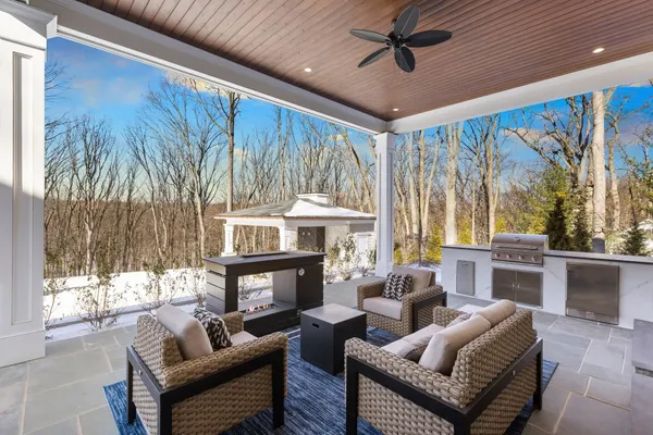 a large kitchen with kitchen island a sink a counter space and stainless steel appliances