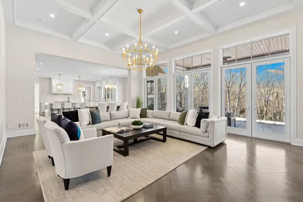 a large kitchen with a table and chairs