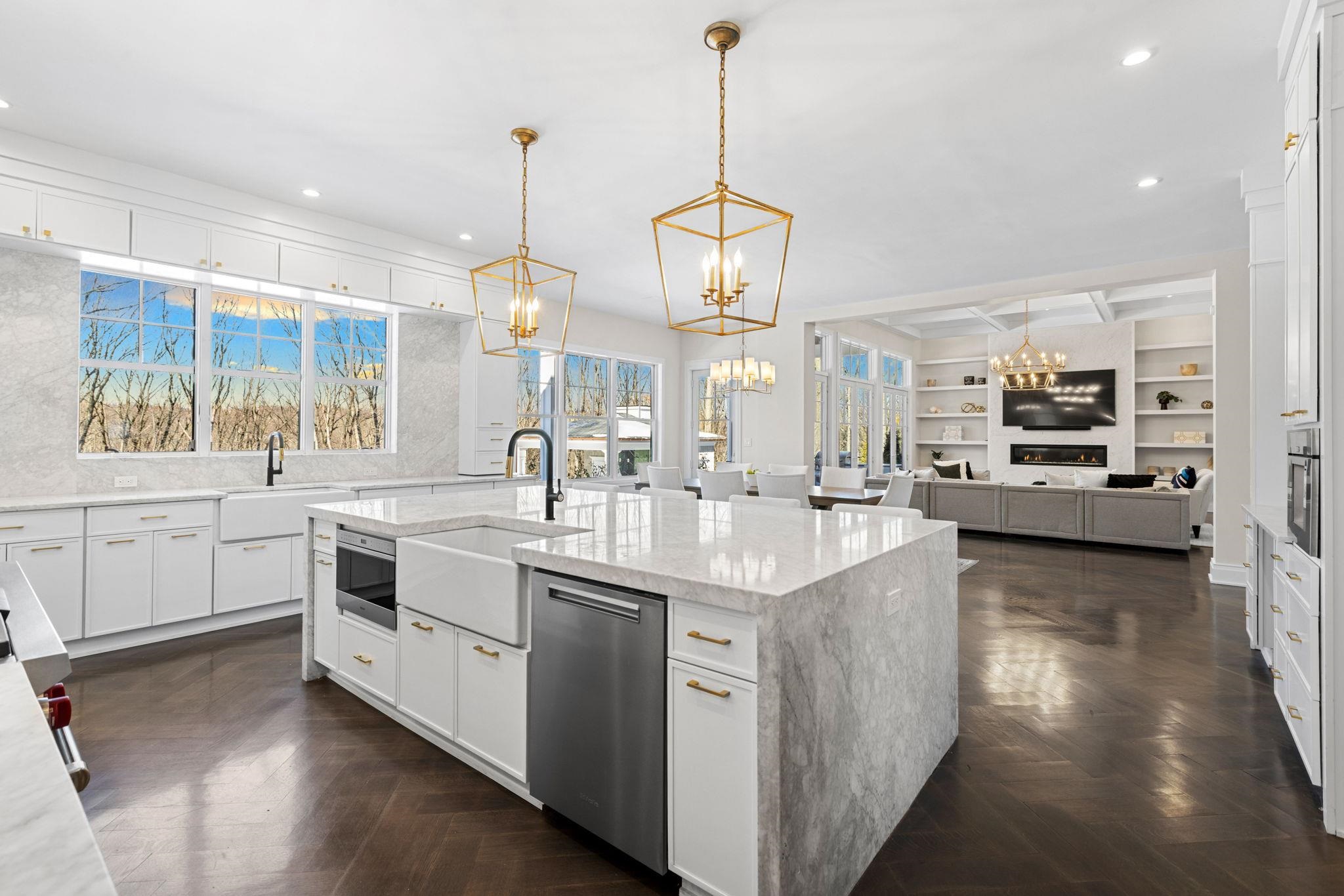 396 Knollwood Road Ridgewood, NJ 07450 - Photo 20 of 50 a large kitchen with kitchen island a sink a counter space and stainless steel appliances
