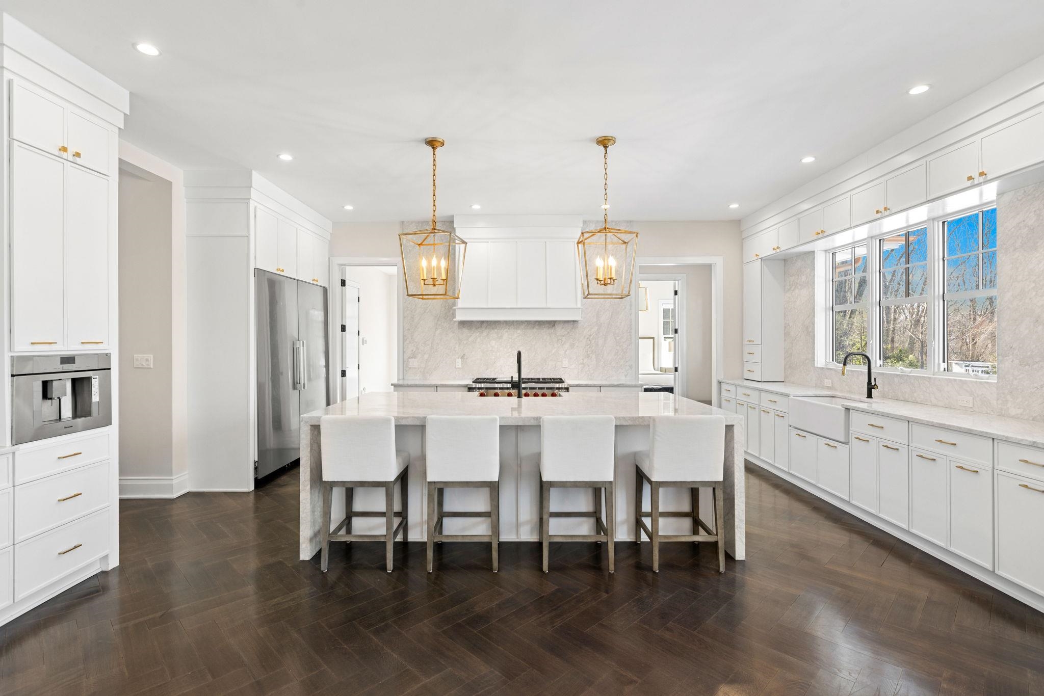 396 Knollwood Road Ridgewood, NJ 07450 - Photo 21 of 50 a large kitchen with a table and chairs