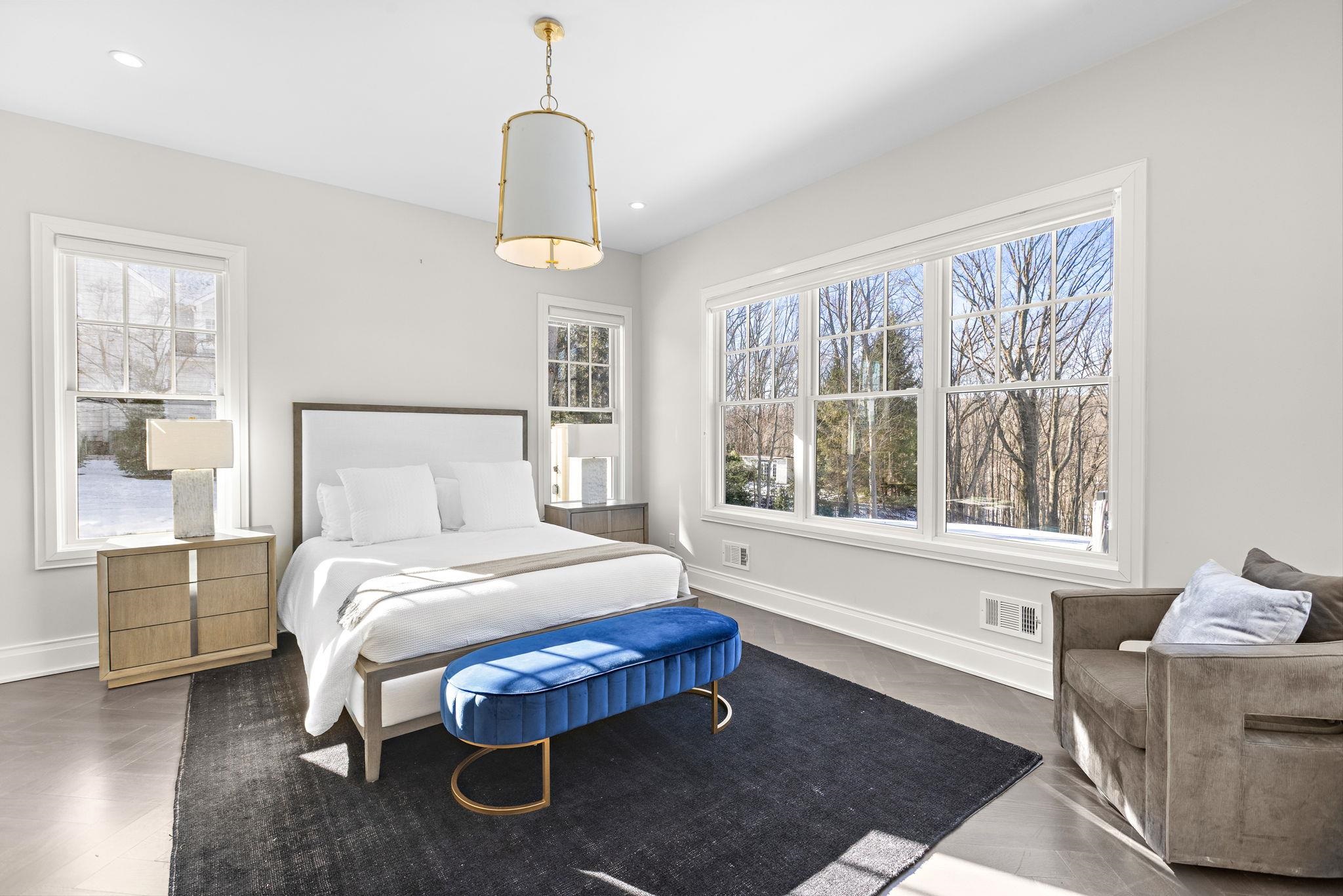 396 Knollwood Road Ridgewood, NJ 07450 - Photo 26 of 50 a bedroom with a bed wooden floor and window