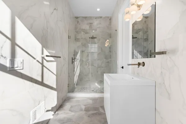 a spacious bedroom with a bed and a couch