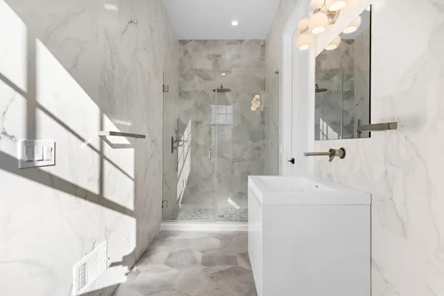 a spacious bedroom with a bed and a couch