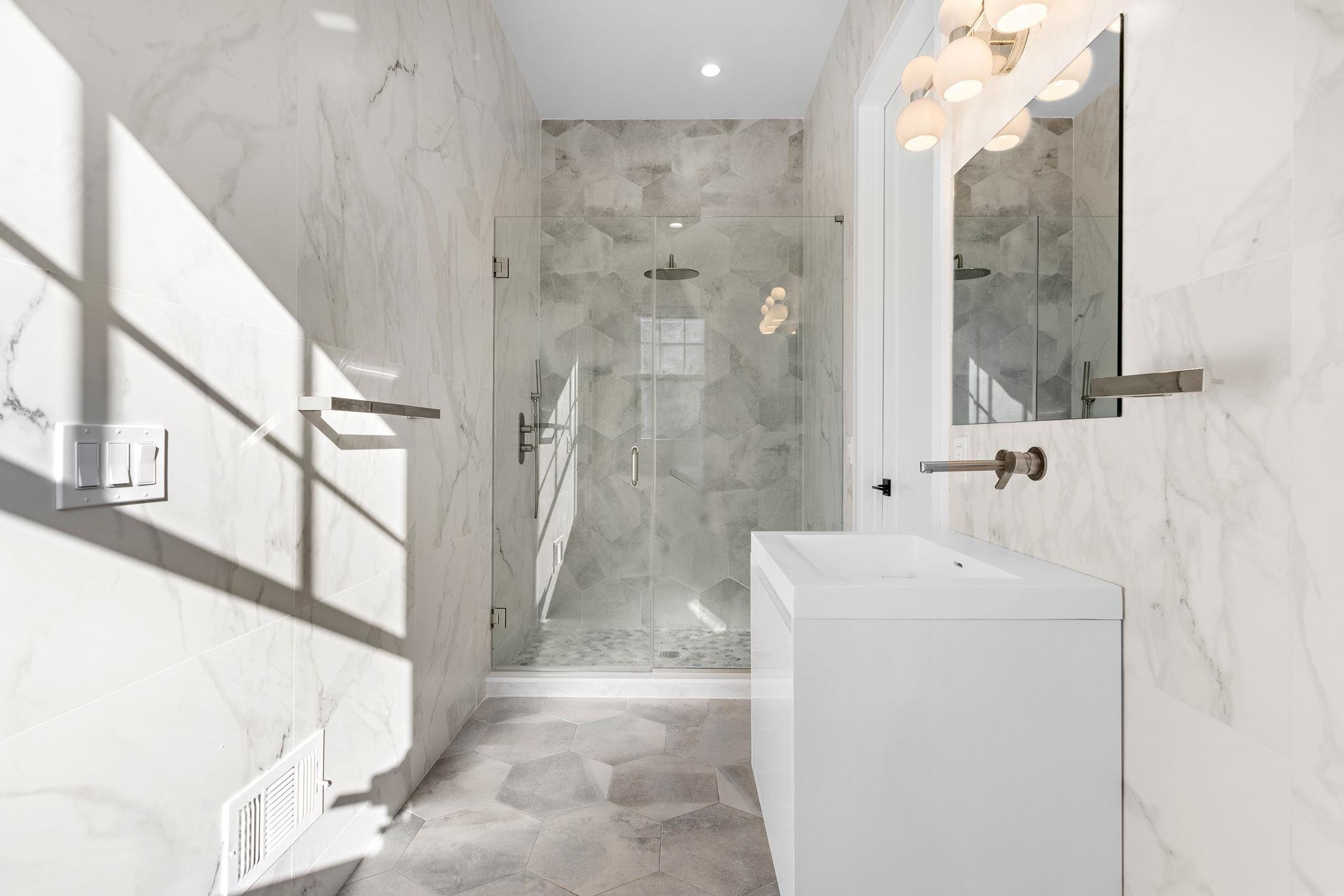 396 Knollwood Road Ridgewood, NJ 07450 - Photo 27 of 50 a bathroom with a sink a toilet and a mirror