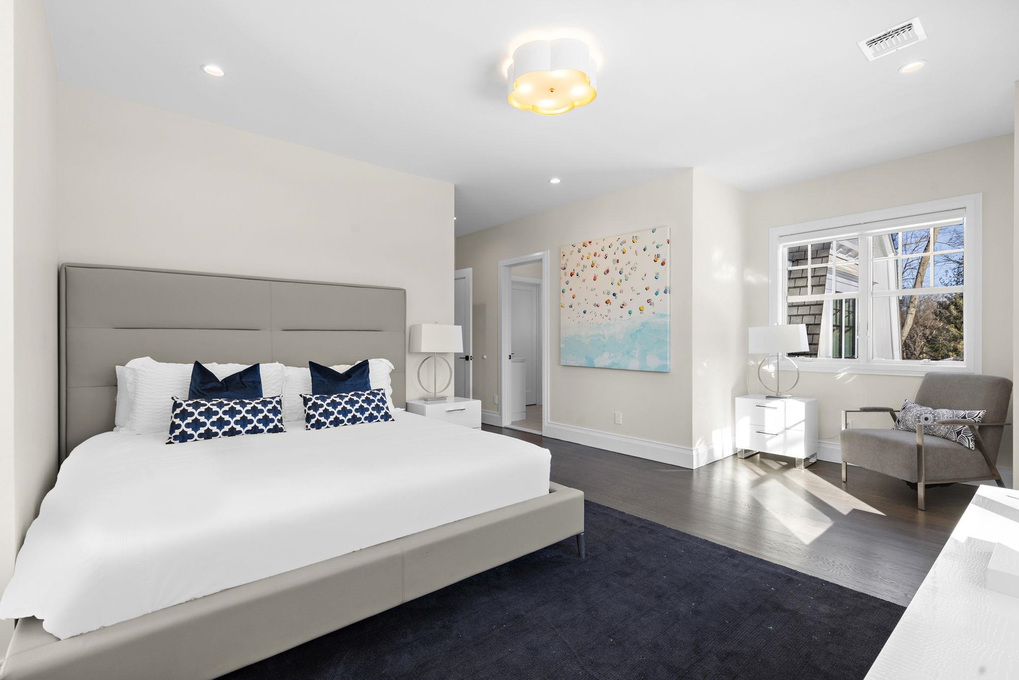 396 Knollwood Road Ridgewood, NJ 07450 - Photo 35 of 50 a bedroom with a large bed couch and a window