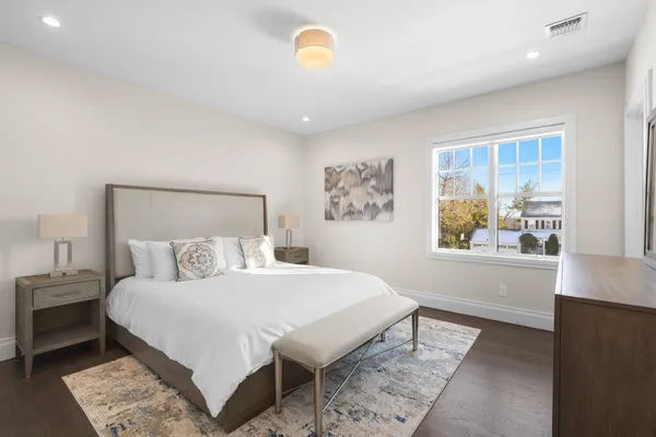 a bedroom with a bed and a book shelf