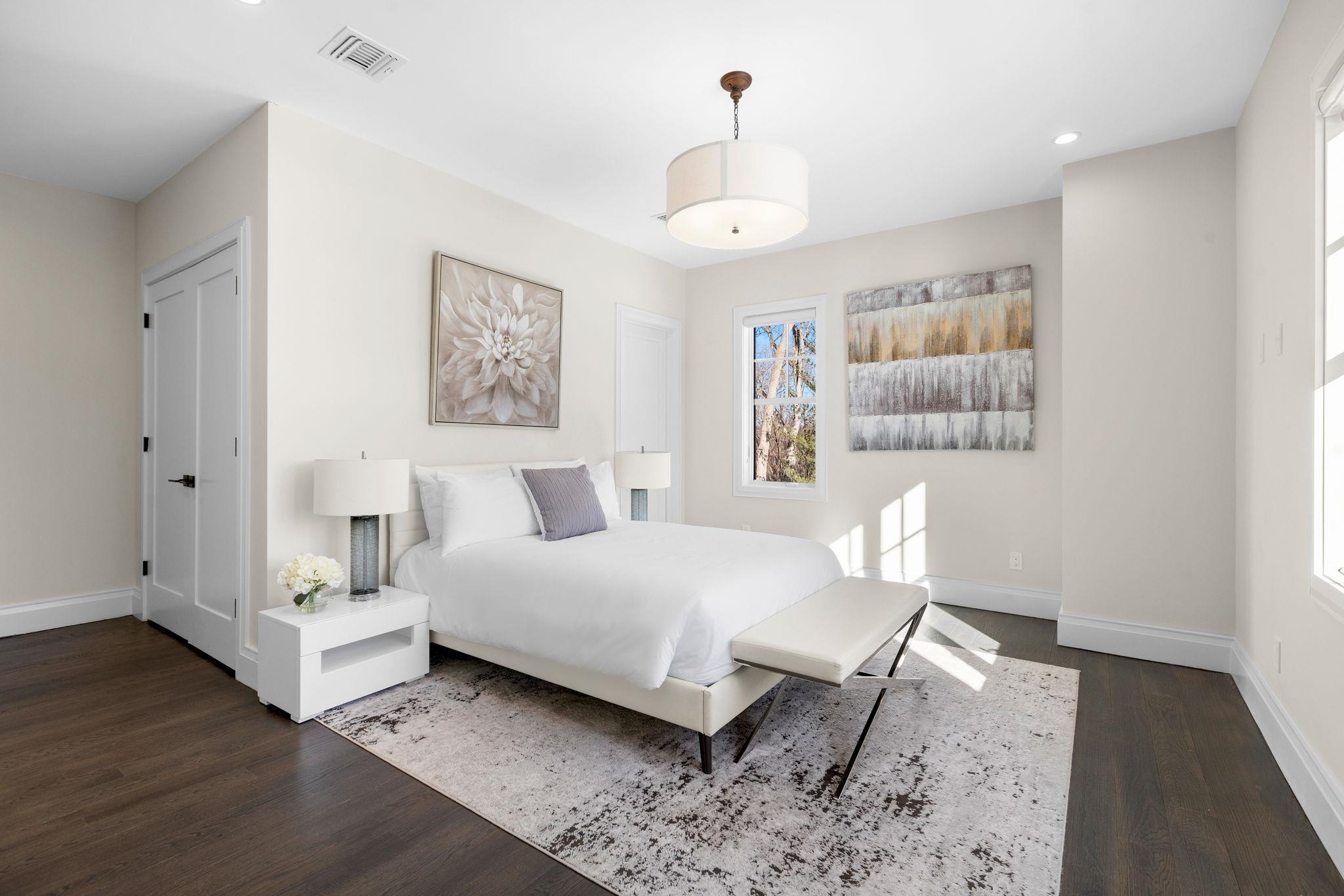 396 Knollwood Road Ridgewood, NJ 07450 - Photo 39 of 50 a bedroom with a bed and a book shelf