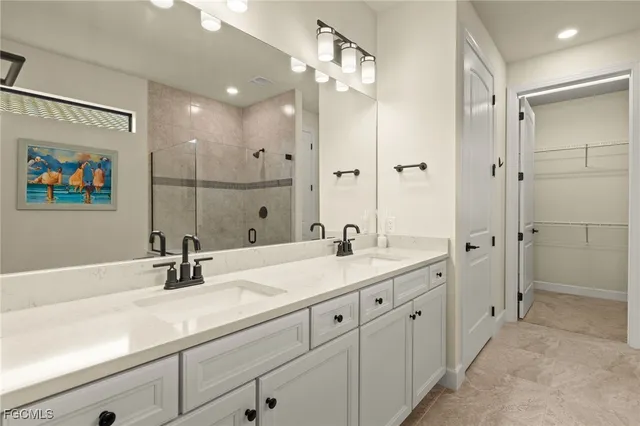 a bathroom with a double vanity sink mirror and double