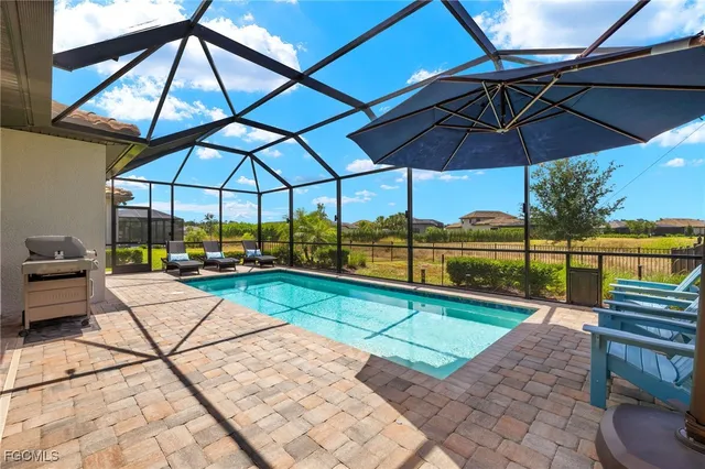 a view of a backyard with sitting area