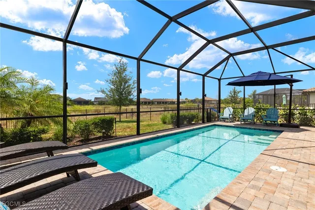 a view of swimming pool with seating area