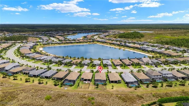 an aerial view of a house with a ocean view