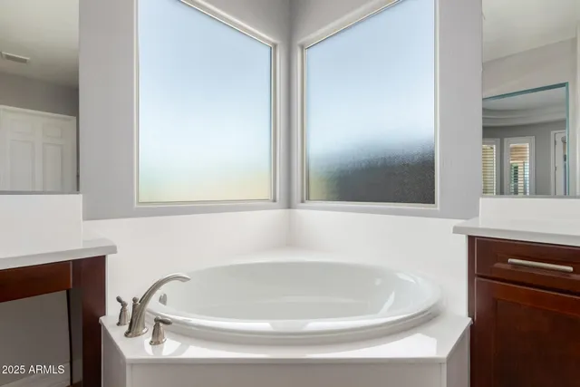 a white bath tub sitting in a bathroom