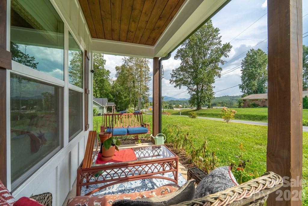 190 Fort Hembree Road Hayesville, NC 28904 - Photo 17 of 18 a view of a porch with furniture and garden