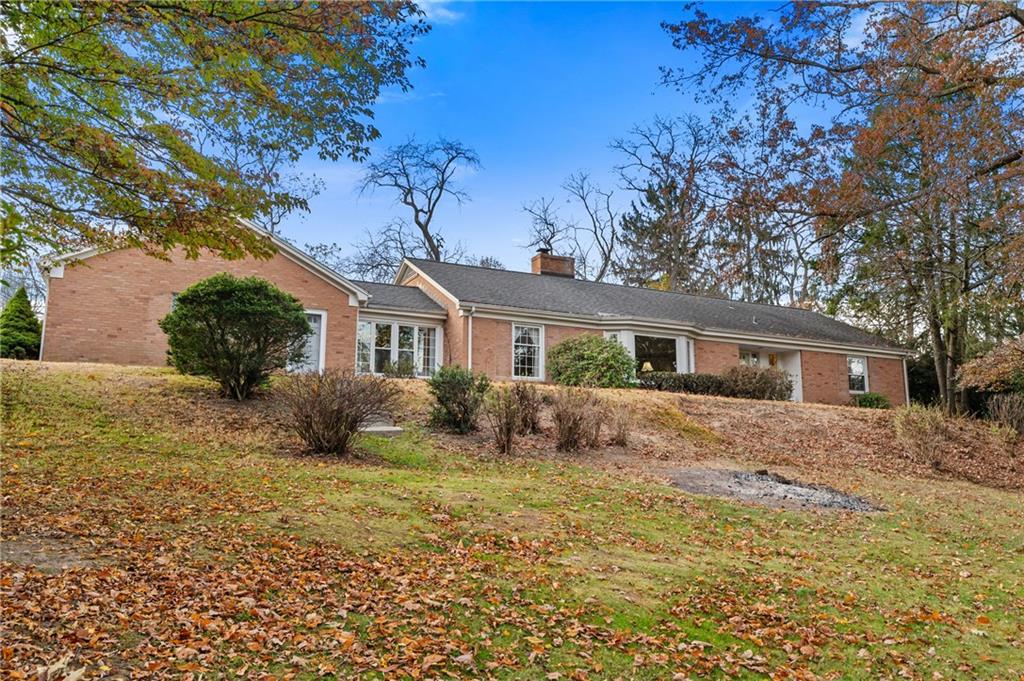 246 Sunset Road Pittsburgh, PA 15237 - Photo 1 of 38 a front view of house with yard and trees in the background