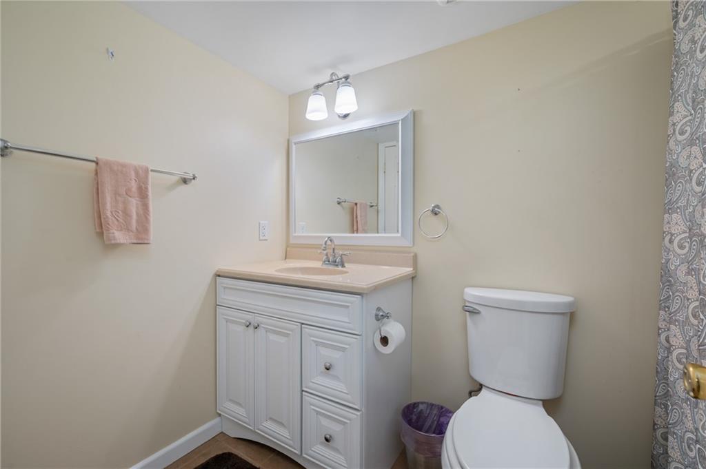 246 Sunset Road Pittsburgh, PA 15237 - Photo 27 of 38 a bathroom with a toilet sink and mirror