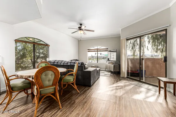 a view of a dining room with furniture window and outside view