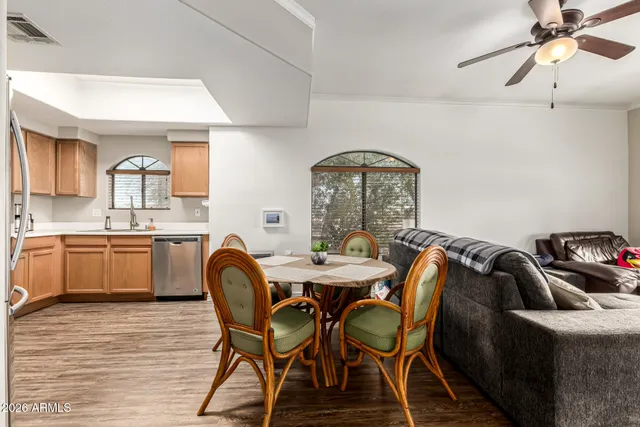 a view of a dining room with furniture and wooden floor