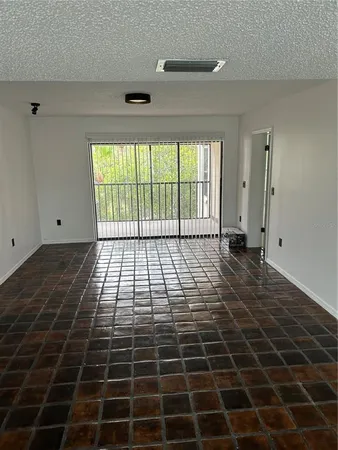 a view of empty room with windows