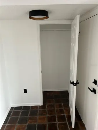 a view of small space with racks on the wall