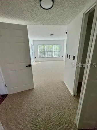 a view of a bathroom with a sink and shower