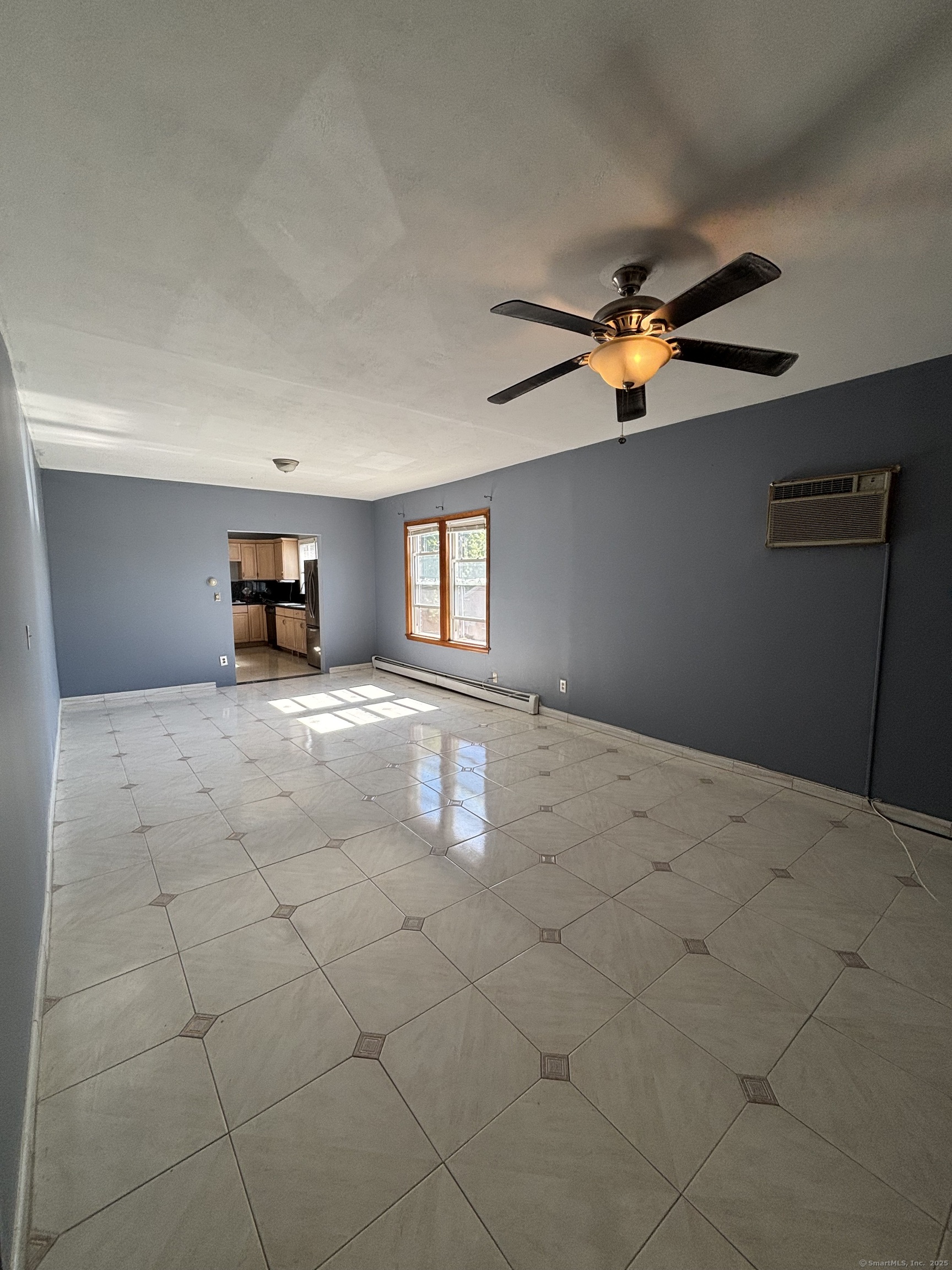 552 Franklin Avenue Hartford, CT 06114 - Photo 14 of 23 a view of a livingroom with a ceiling fan and window