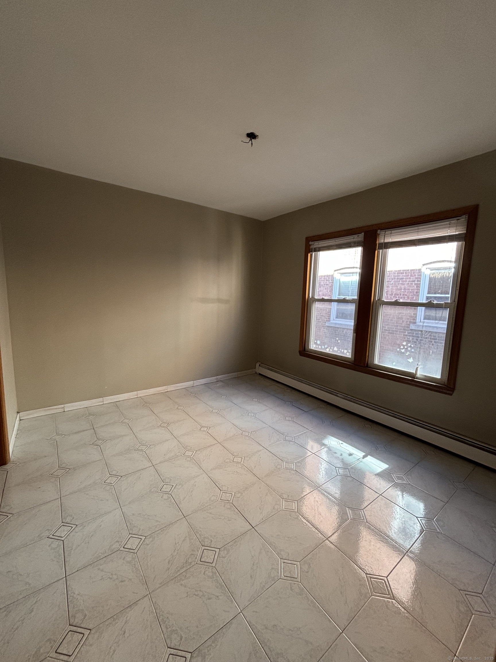 552 Franklin Avenue Hartford, CT 06114 - Photo 22 of 23 a view of an empty room with a window