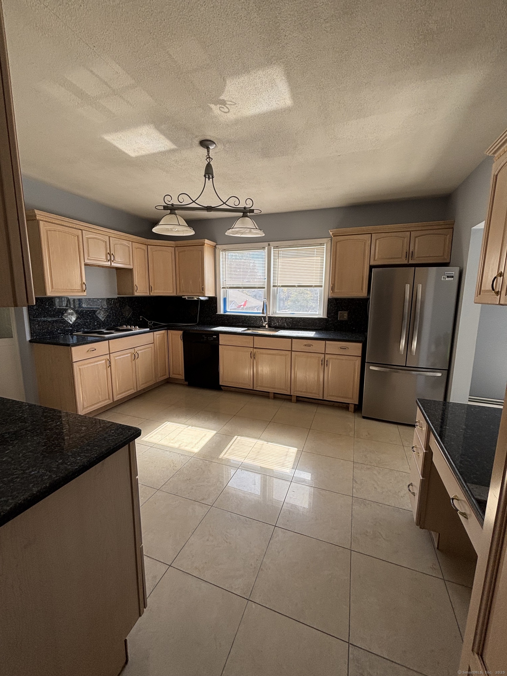 552 Franklin Avenue Hartford, CT 06114 - Photo 7 of 23 a kitchen with stainless steel appliances granite countertop a sink and a stove