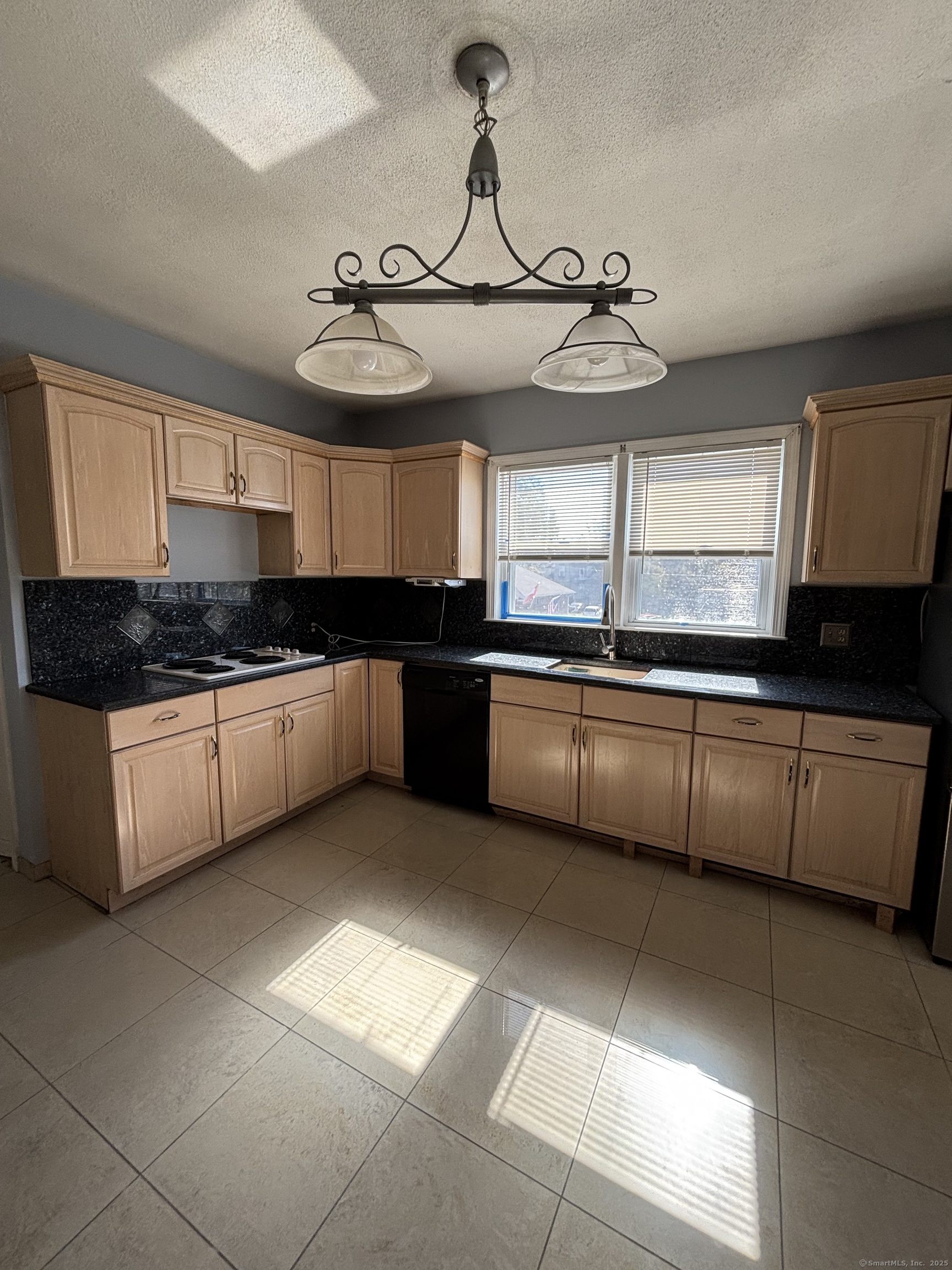 552 Franklin Avenue Hartford, CT 06114 - Photo 10 of 23 a kitchen with granite countertop a sink a counter top space cabinets and stainless steel appliances