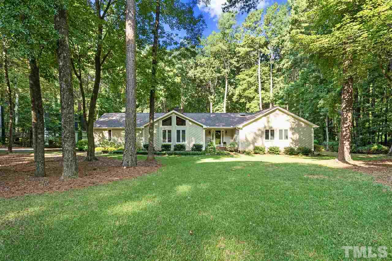 8609 Langtree Lane Raleigh, NC 27613 - Photo 1 of 30 a front view of a house with yard porch and green space