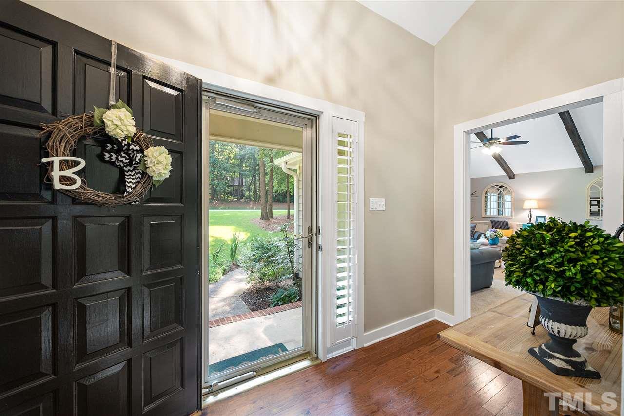 8609 Langtree Lane Raleigh, NC 27613 - Photo 3 of 30 a very nice looking room with a potted plant