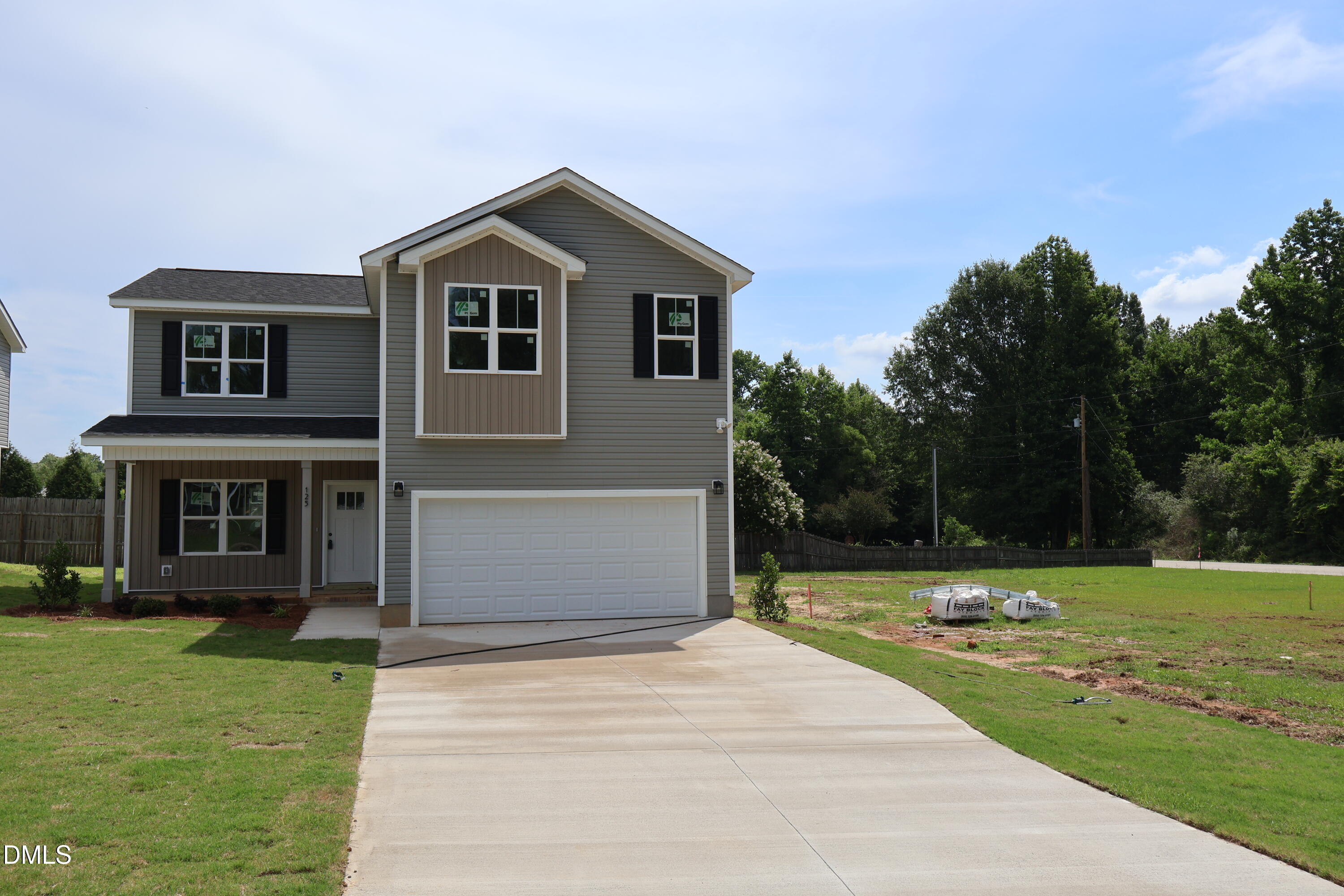 125 Wilson Street Erwin, NC 28339 - Photo 1 of 22 a front view of a house with garden