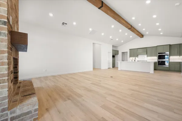a view of kitchen and refrigerator