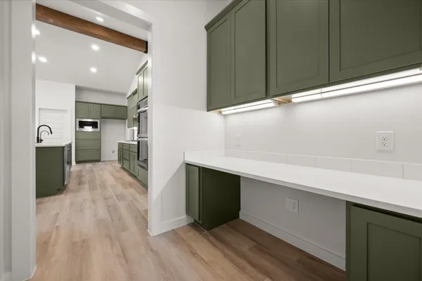 a kitchen with a sink and cabinets