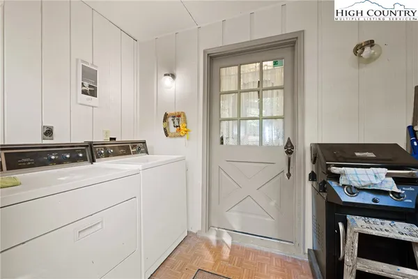 a room with pool table and windows